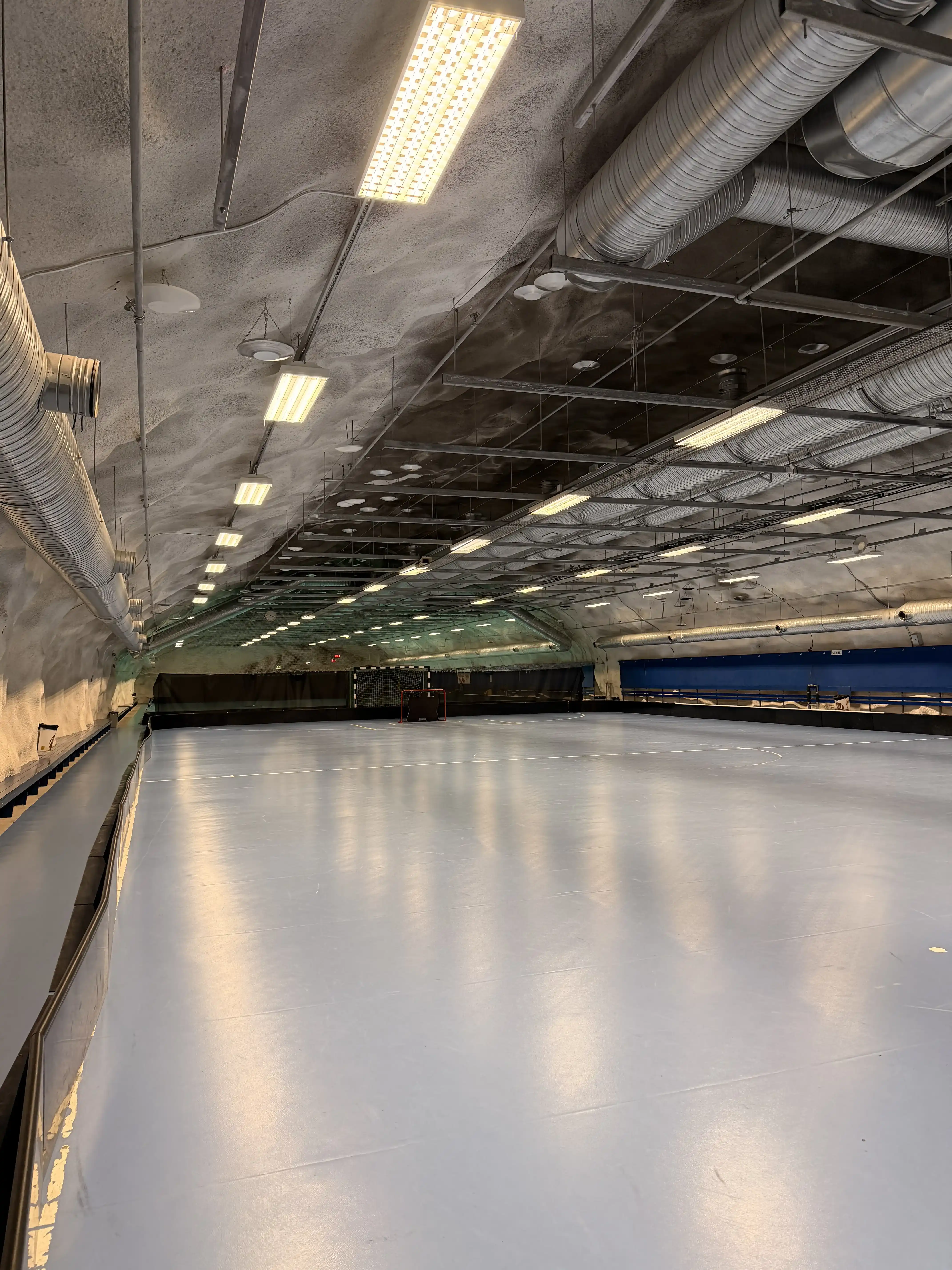 Underground sports hall with a blue floor